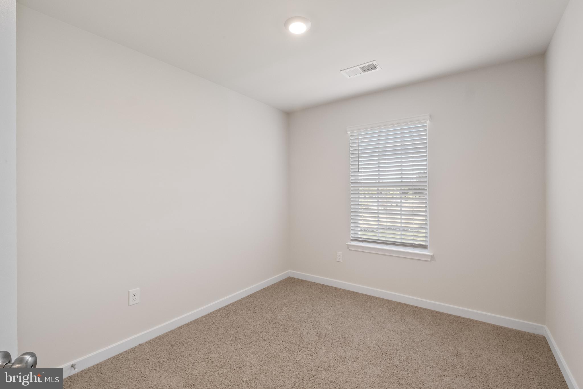 5019 Silver Oak Drive Rosedale, MD 21237 - Photo 23 of 43 an empty room with a window