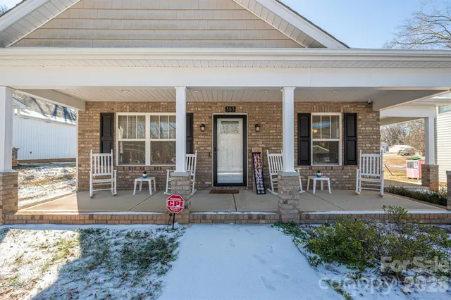 front view of house with outdoor seating