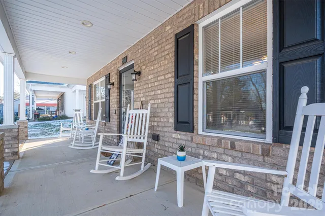 a view of a swimming pool with outdoor seating