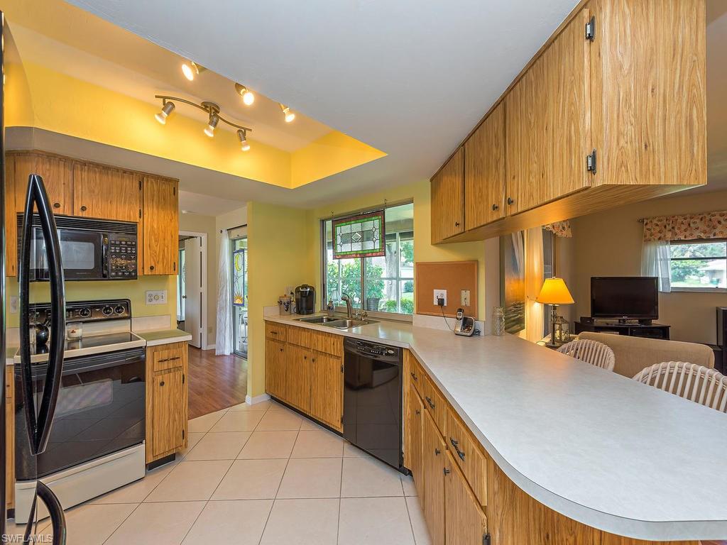 Kitchen has nice newer refrigerator