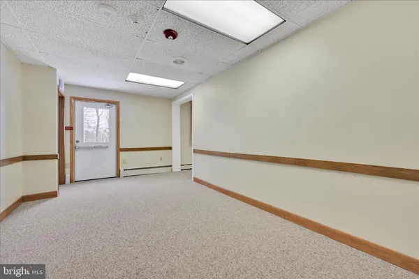 a view of a room with lots of dining room and wooden floor