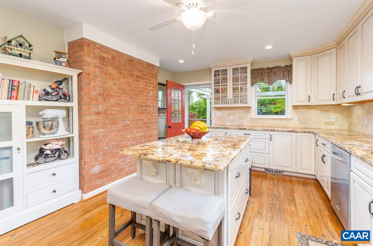 2417 Northfield Road Charlottesville, VA 22901 - Photo 12 of 47 a kitchen with stainless steel appliances granite countertop a sink stove and cabinets