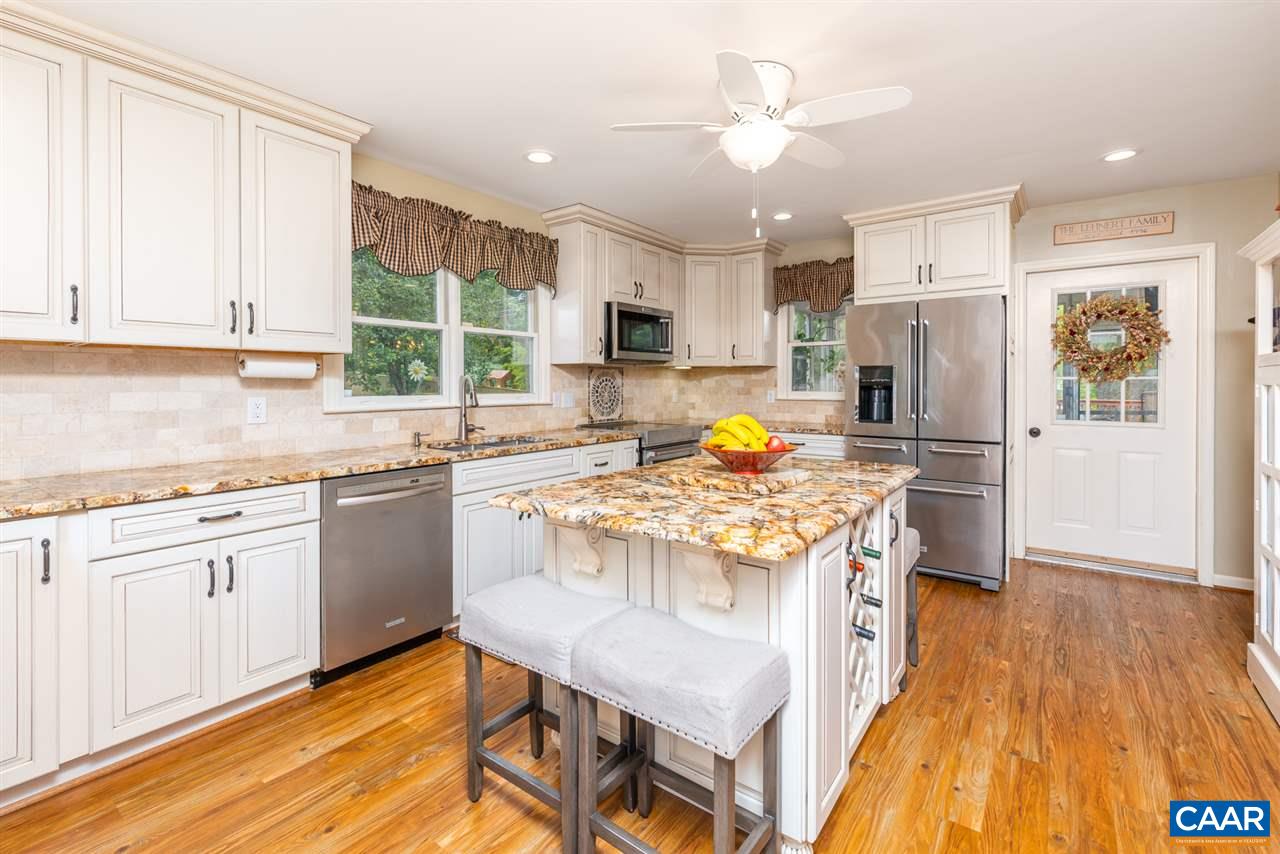 2417 Northfield Road Charlottesville, VA 22901 - Photo 13 of 47 a kitchen with stainless steel appliances granite countertop a sink stove and refrigerator