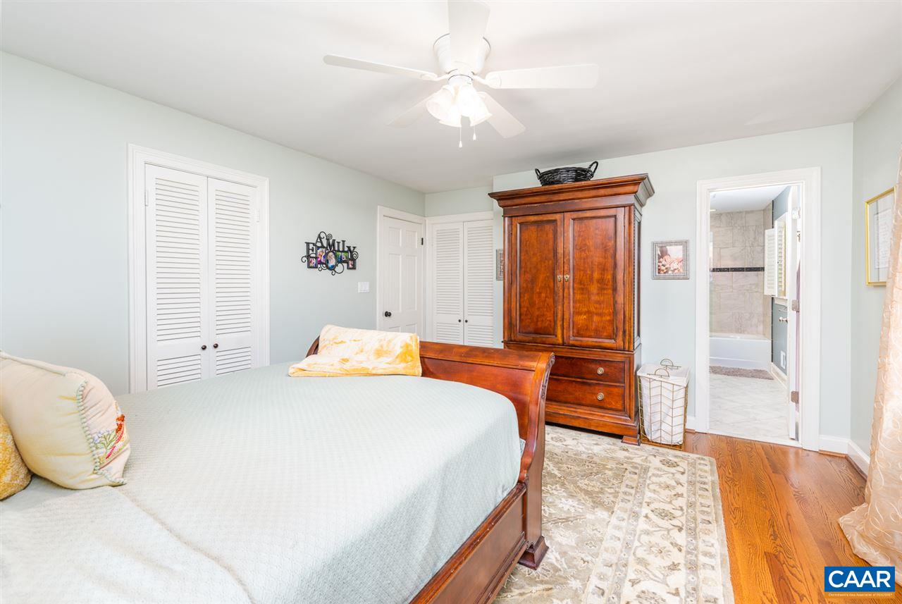 2417 Northfield Road Charlottesville, VA 22901 - Photo 18 of 47 a bedroom with a bed and wooden floor