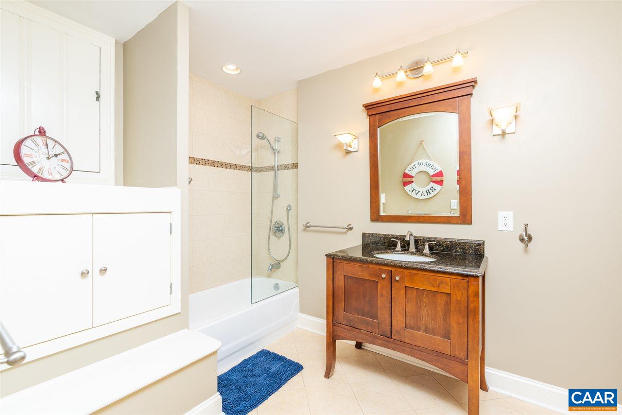 2417 Northfield Road Charlottesville, VA 22901 - Photo 23 of 47 a bathroom with a wooden floor and a shower