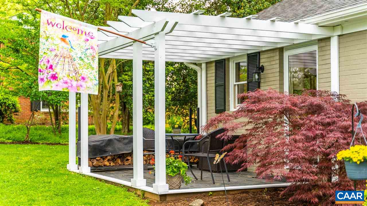 2417 Northfield Road Charlottesville, VA 22901 - Photo 5 of 47 a view of a porch with chairs and potted plants