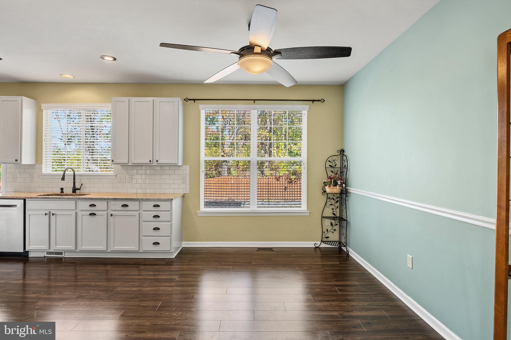 716 Wagner Farm Road Millersville, MD 21108 - Photo 11 of 45 a kitchen with granite countertop a stove a sink and a chandelier