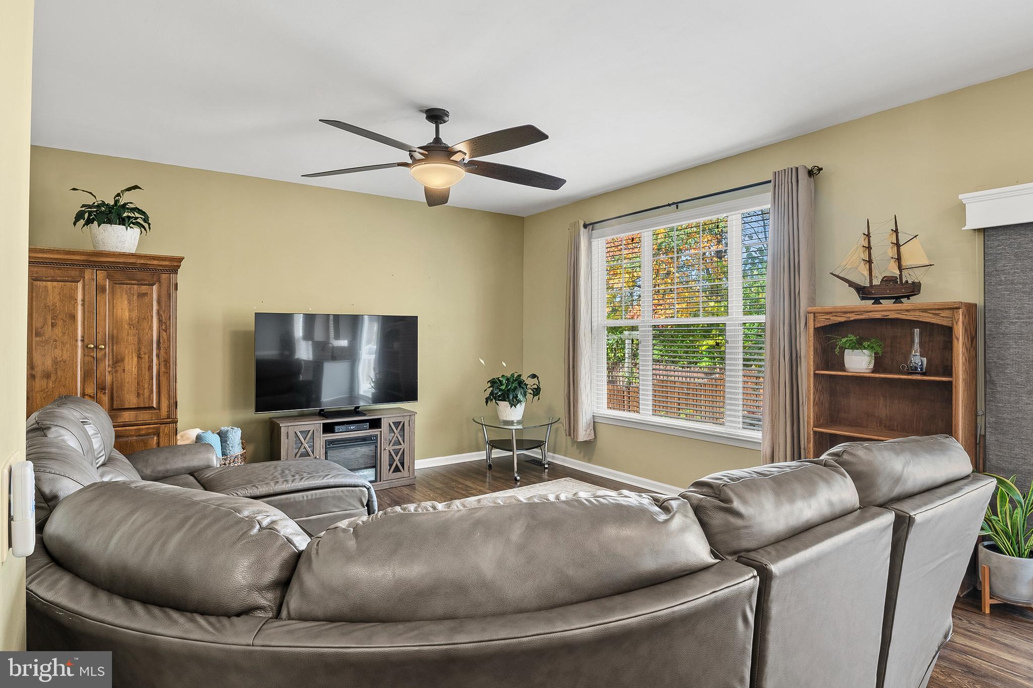 716 Wagner Farm Road Millersville, MD 21108 - Photo 16 of 45 a living room with furniture and a flat screen tv