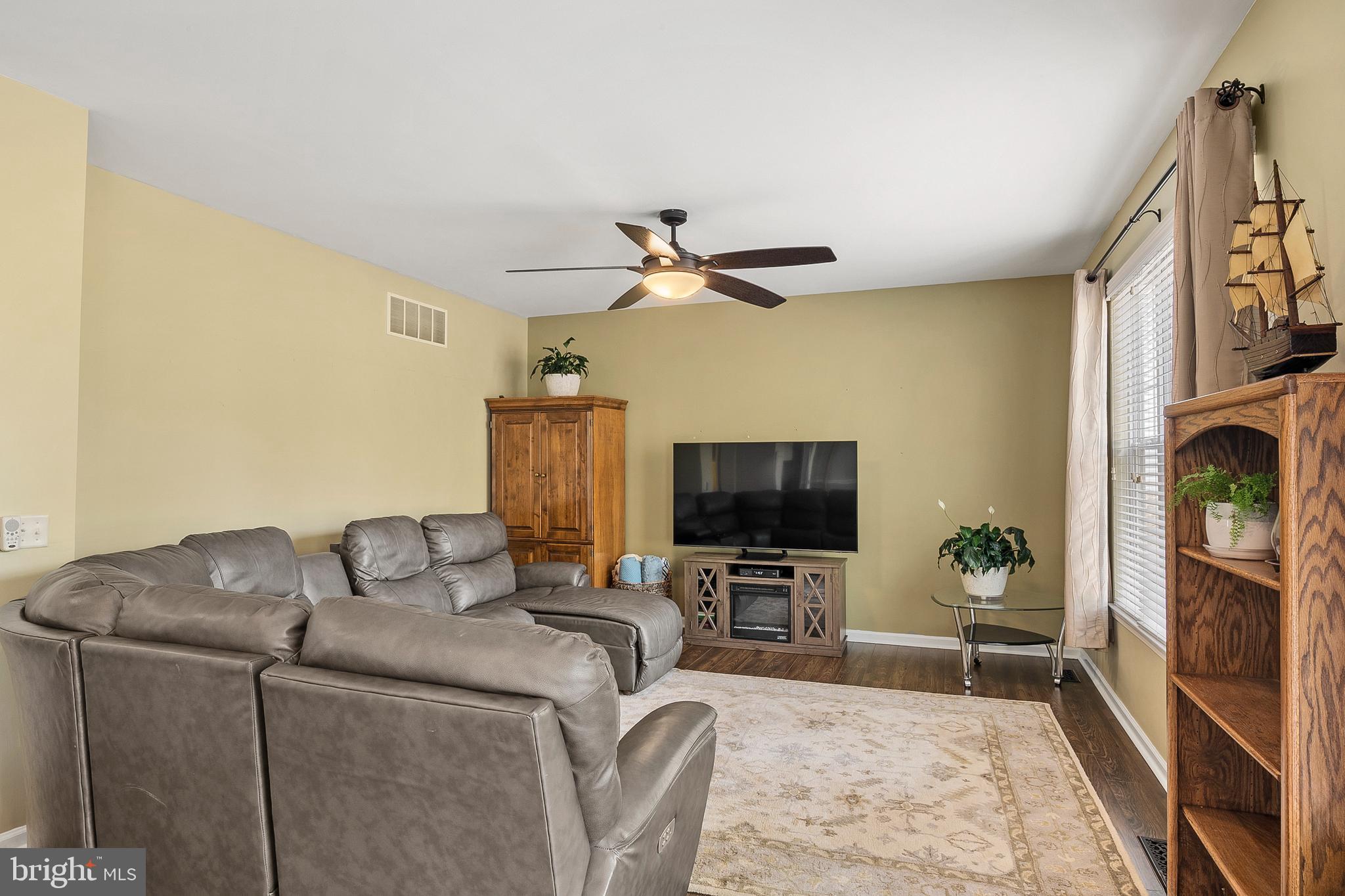 716 Wagner Farm Road Millersville, MD 21108 - Photo 17 of 45 a living room with furniture and a flat screen tv