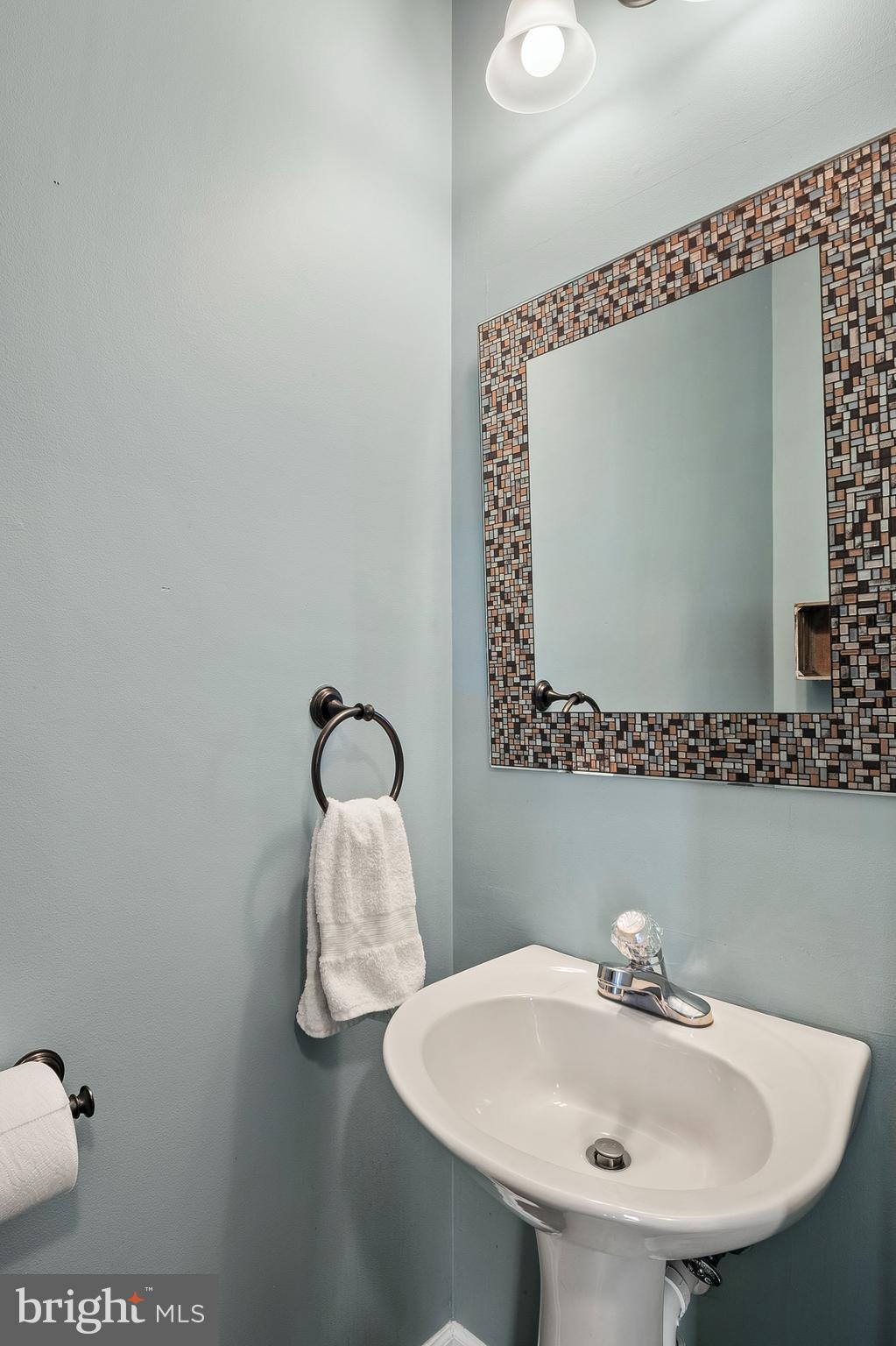 716 Wagner Farm Road Millersville, MD 21108 - Photo 19 of 45 a bathroom with a sink and mirror