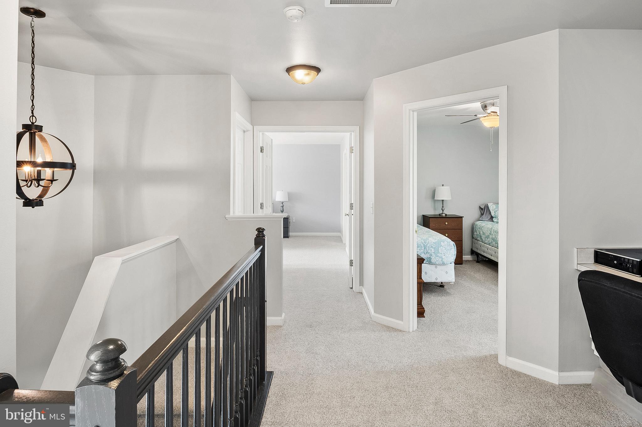 716 Wagner Farm Road Millersville, MD 21108 - Photo 23 of 45 a view of a hallway and a livingroom with furniture