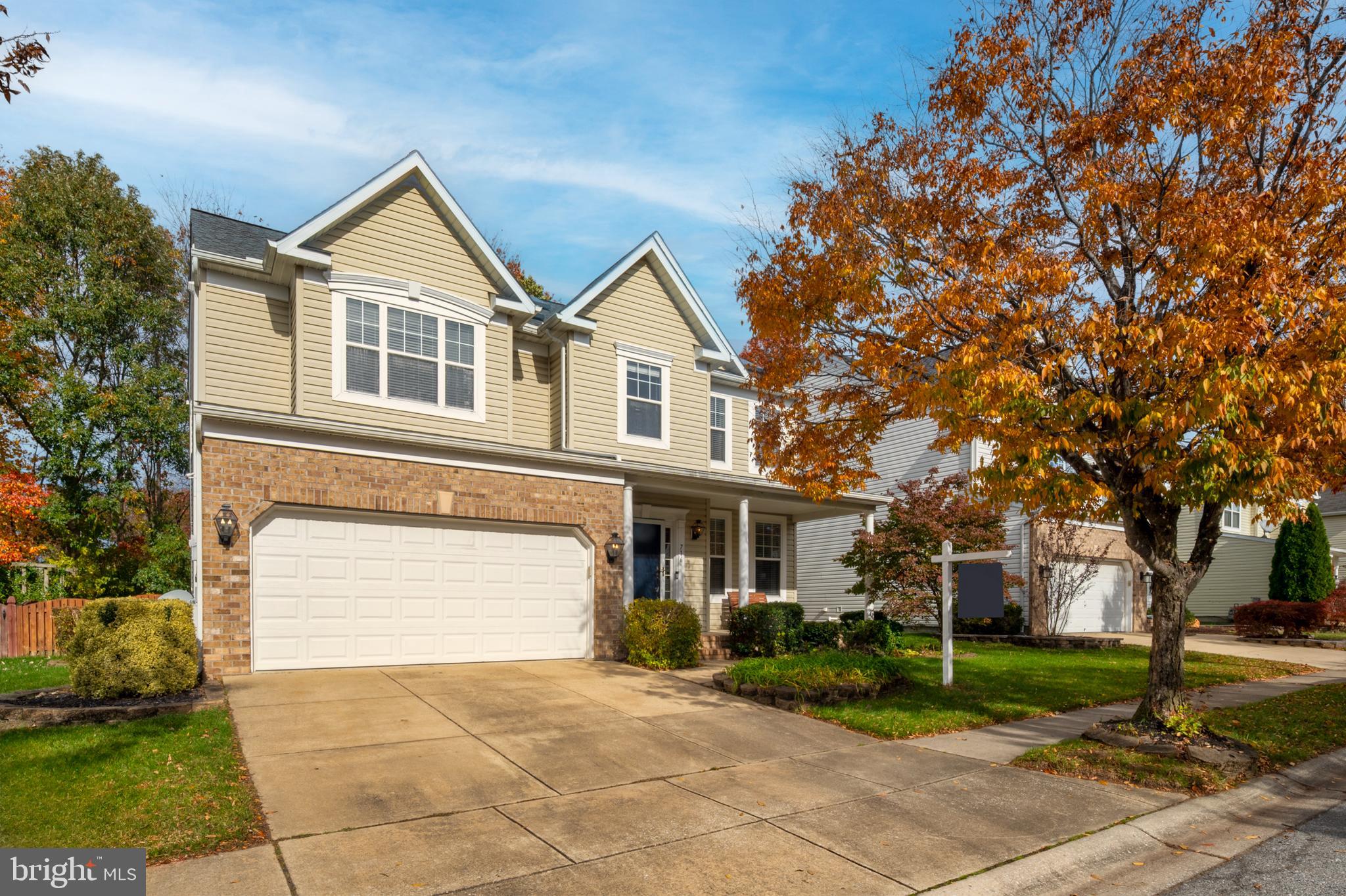 716 Wagner Farm Road Millersville, MD 21108 - Photo 3 of 45 a front view of a house with a yard and trees