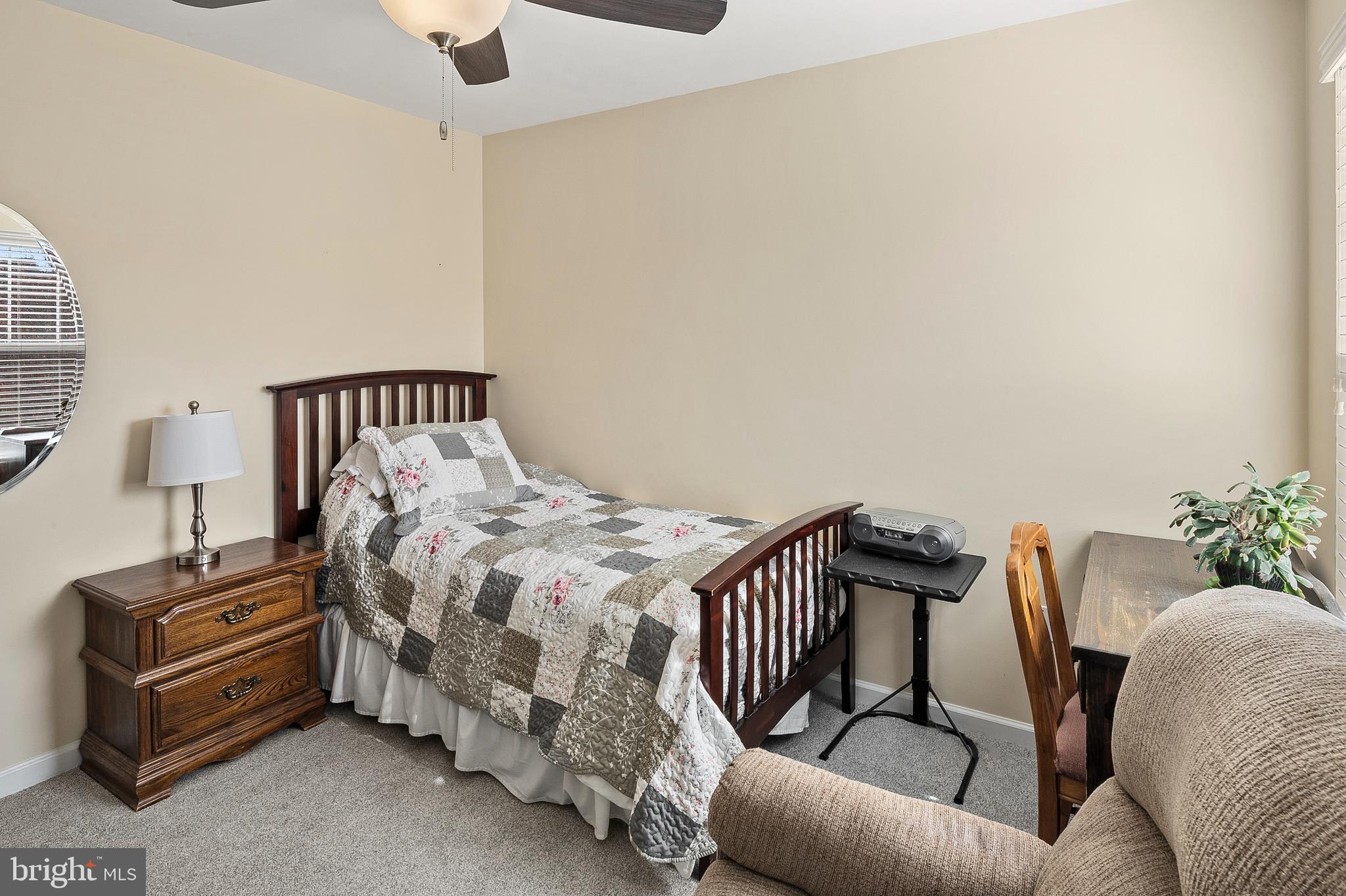 716 Wagner Farm Road Millersville, MD 21108 - Photo 31 of 45 a bedroom with furniture and a potted plant