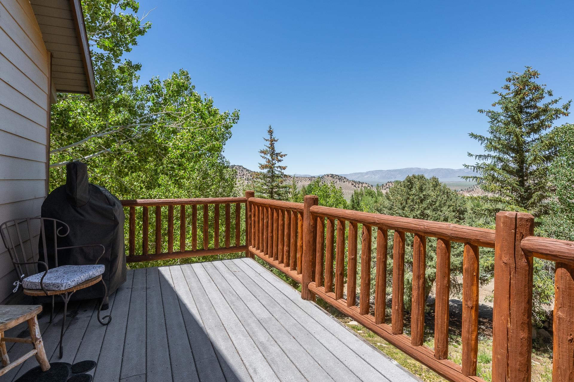 537 Aspen Spring Ranch Road Mammoth Lakes, CA 93546 - Photo 11 of 40 Expansive outdoor deck featuring wood-finish flooring and rustic log railing