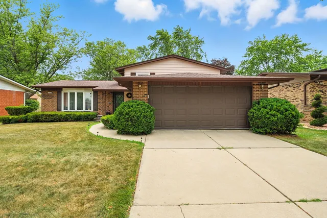 a front view of a house with yard