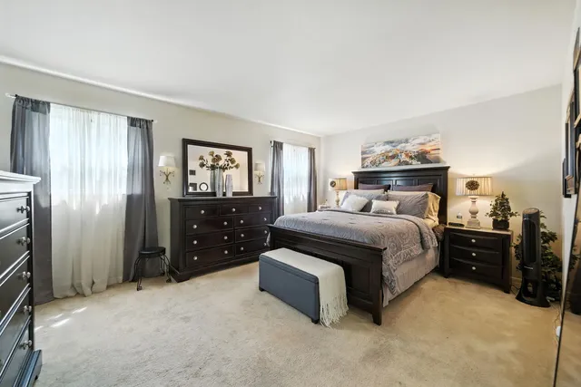 a bedroom with a bed and cabinets