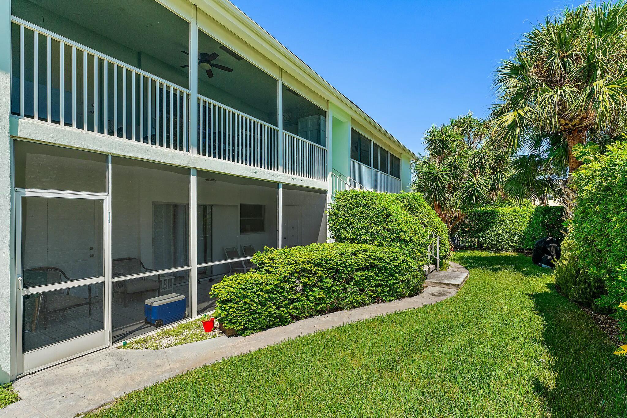 3036 Park Avenue Riviera Beach, FL 33404 - Photo 18 of 22 a view of backyard with potted plants and wooden fence