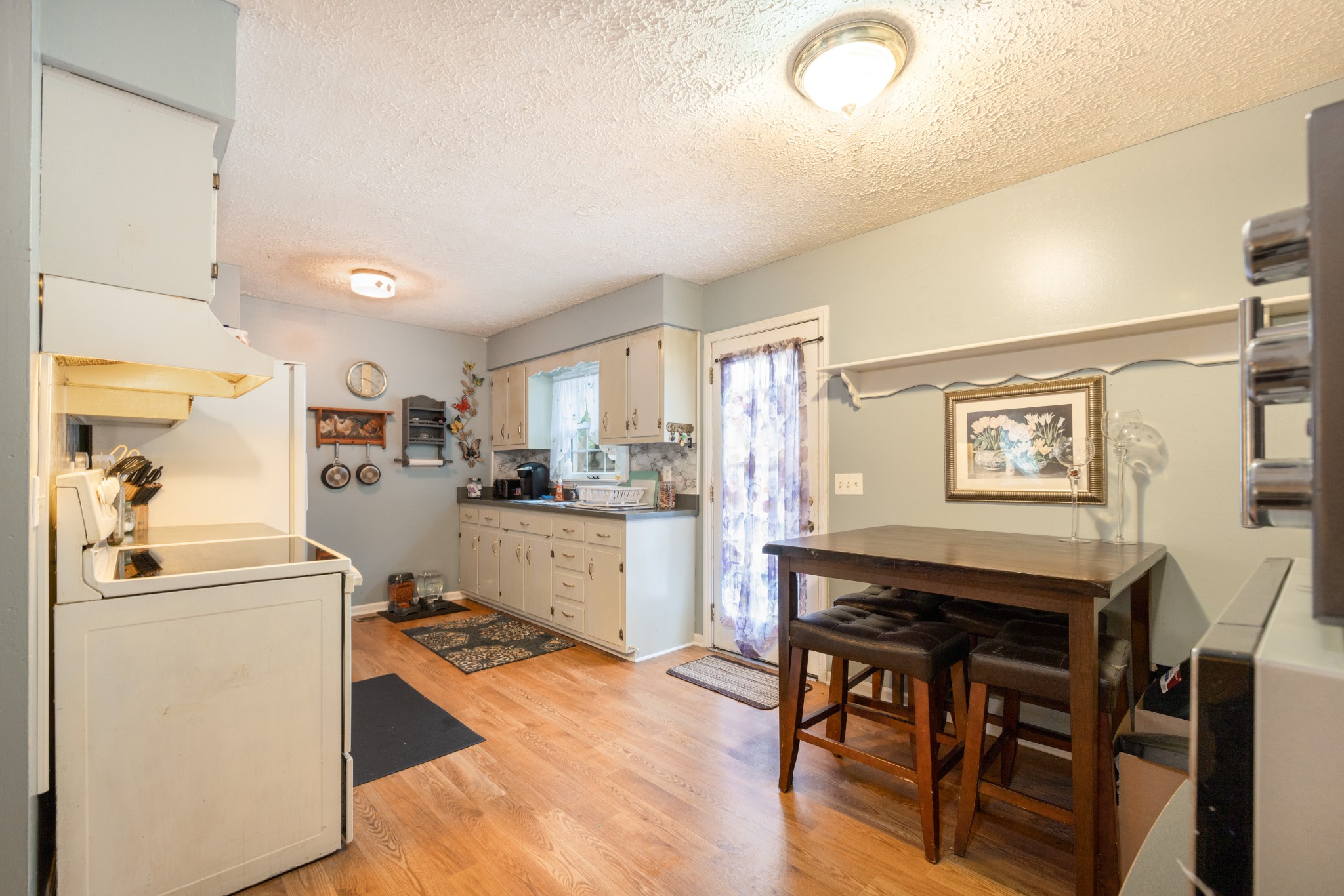 5622 Hopewell Road Springfield, TN 37172 - Photo 11 of 23 a view of a dining room with furniture and wooden floor