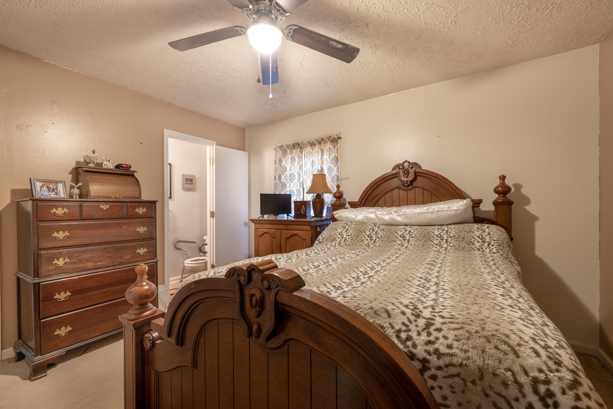 5622 Hopewell Road Springfield, TN 37172 - Photo 15 of 23 a bed room with a bed and a ceiling fan