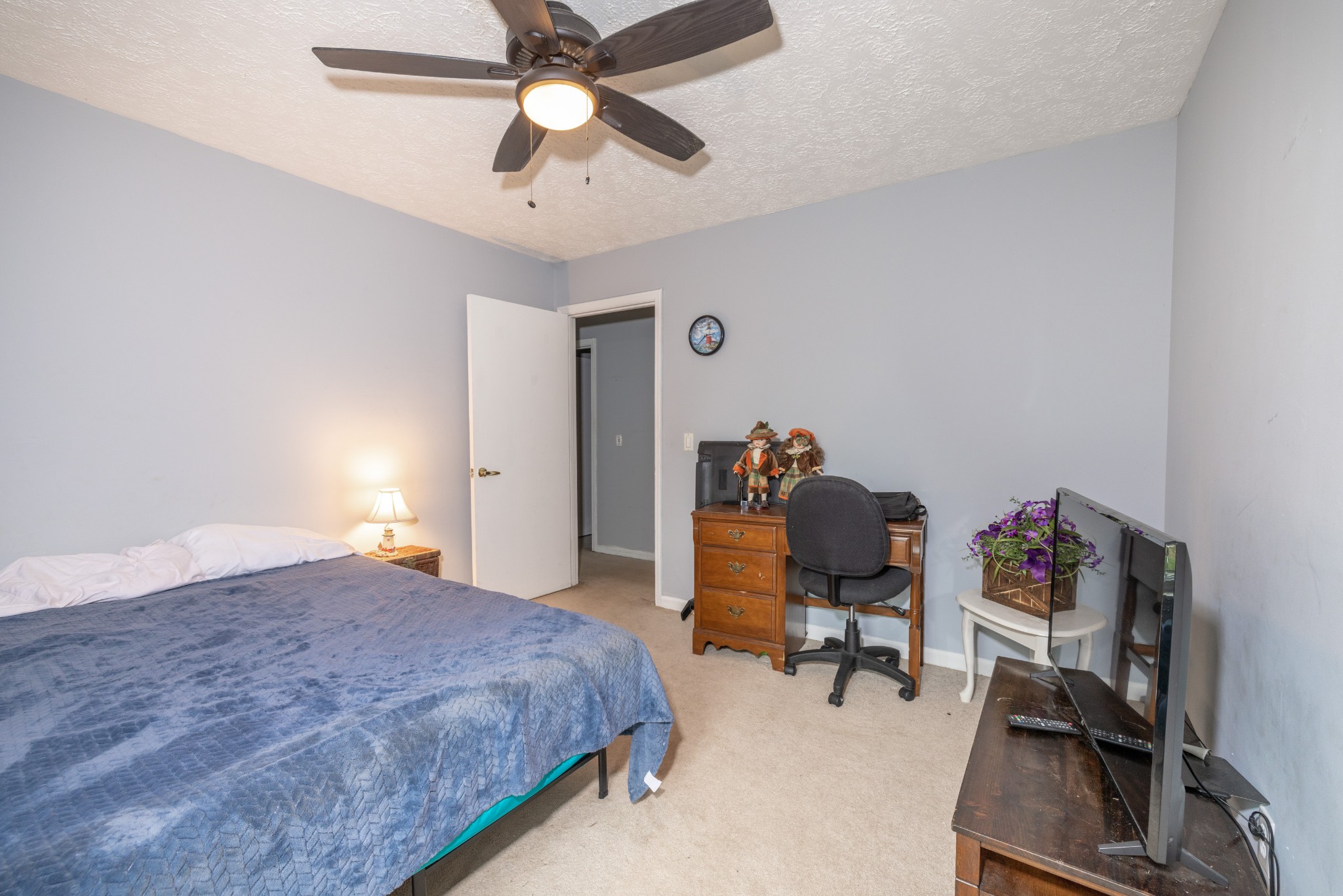 5622 Hopewell Road Springfield, TN 37172 - Photo 19 of 23 a bedroom with a bed and a chandelier
