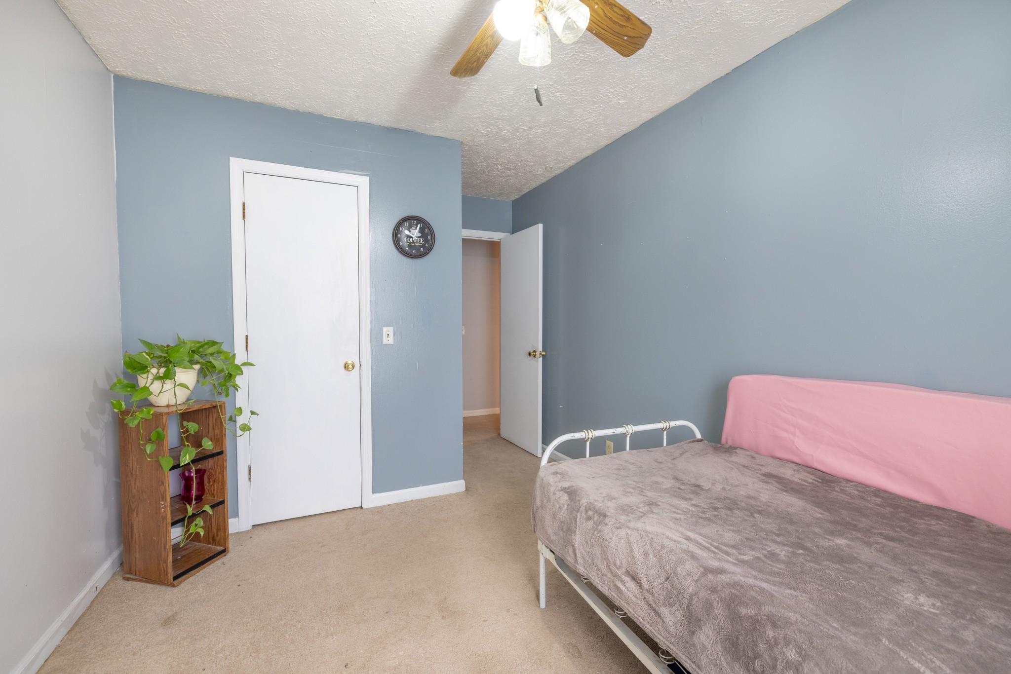 5622 Hopewell Road Springfield, TN 37172 - Photo 23 of 23 a bedroom with a bed table and a chandelier