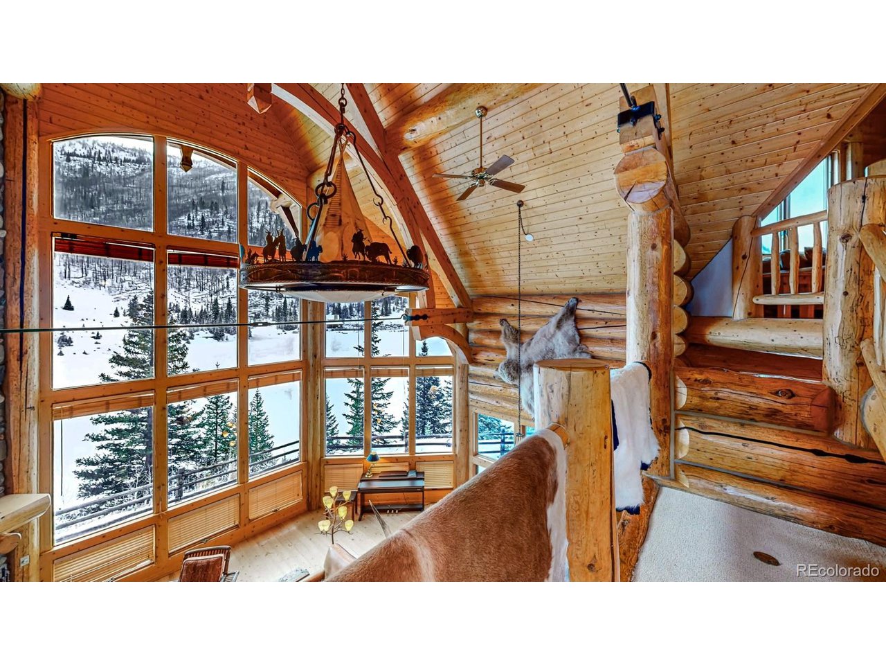 2418 Forest Road Creede, CO 81130 - Photo 19 of 50 a room with furniture and a large window