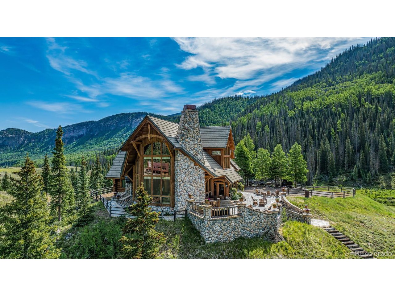 2418 Forest Road Creede, CO 81130 - Photo 34 of 50 a balcony with furniture and a garden