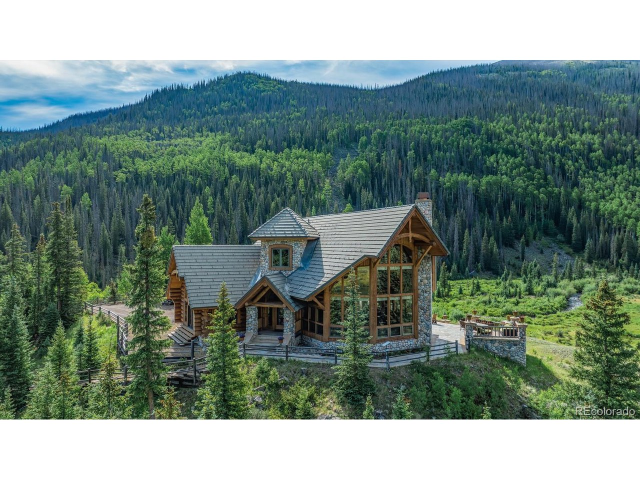 2418 Forest Road Creede, CO 81130 - Photo 37 of 50 a view of a house with a yard