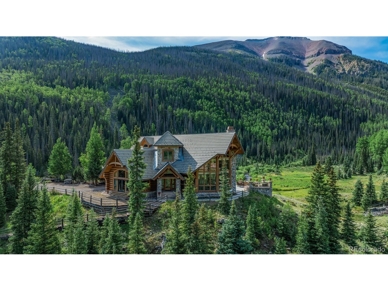 2418 Forest Road Creede, CO 81130 - Photo 38 of 50 a view of a house with a field
