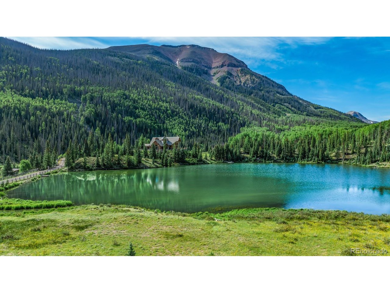 2418 Forest Road Creede, CO 81130 - Photo 42 of 50 a outdoor view of a lake with a mountain in the background