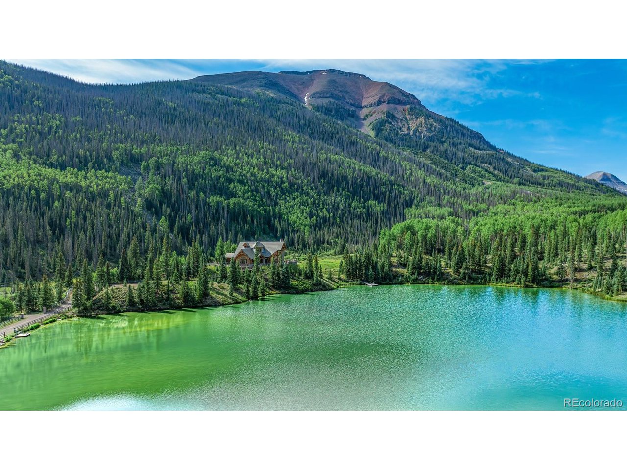 2418 Forest Road Creede, CO 81130 - Photo 46 of 50 a open view of a lake with a mountain in the back
