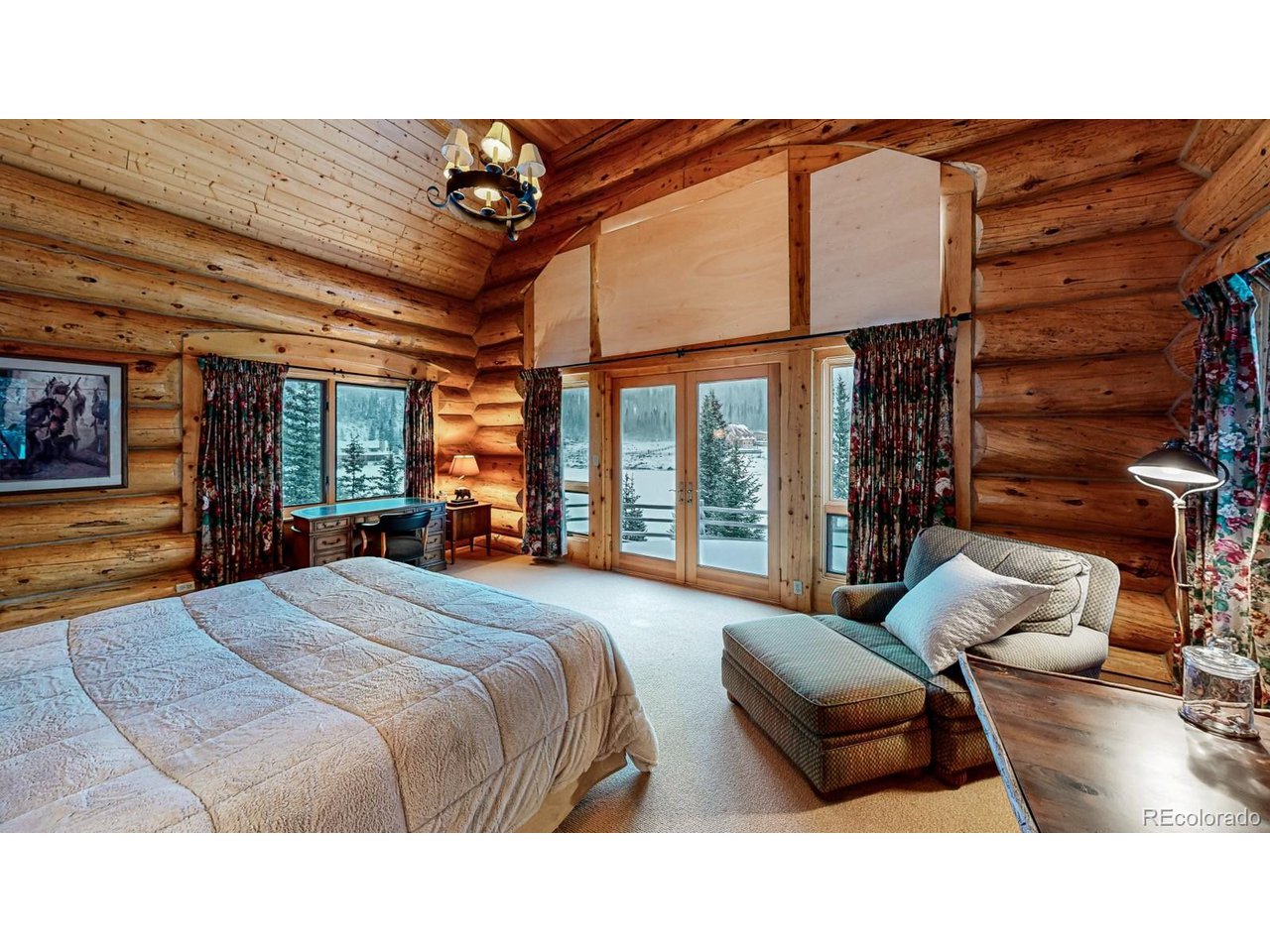2418 Forest Road Creede, CO 81130 - Photo 7 of 50 a bedroom with furniture and a large window