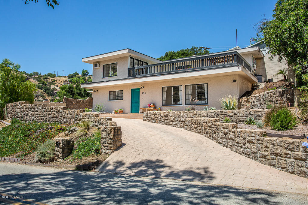 993 Katherine Road Simi Valley, CA 93063 - Photo 2 of 44 a front view of a house with a yard
