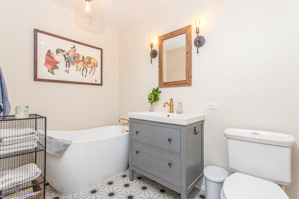 993 Katherine Road Simi Valley, CA 93063 - Photo 16 of 44 a bathroom with a sink mirror vanity and toilet