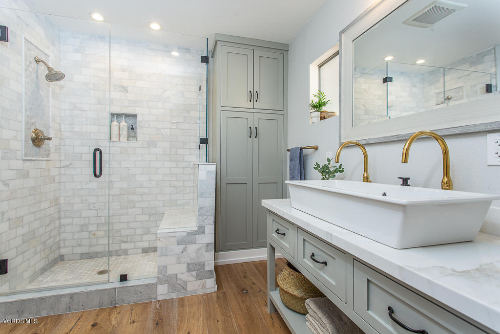 993 Katherine Road Simi Valley, CA 93063 - Photo 20 of 44 a bathroom with a double vanity sink mirror and shower