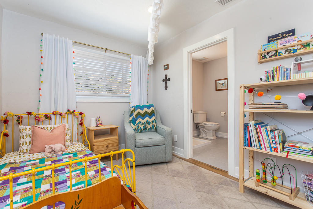 993 Katherine Road Simi Valley, CA 93063 - Photo 22 of 44 a playing room with toys and a book shelf