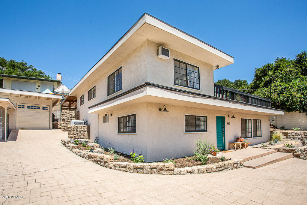 993 Katherine Road Simi Valley, CA 93063 - Photo 4 of 44 a front view of a house with a yard
