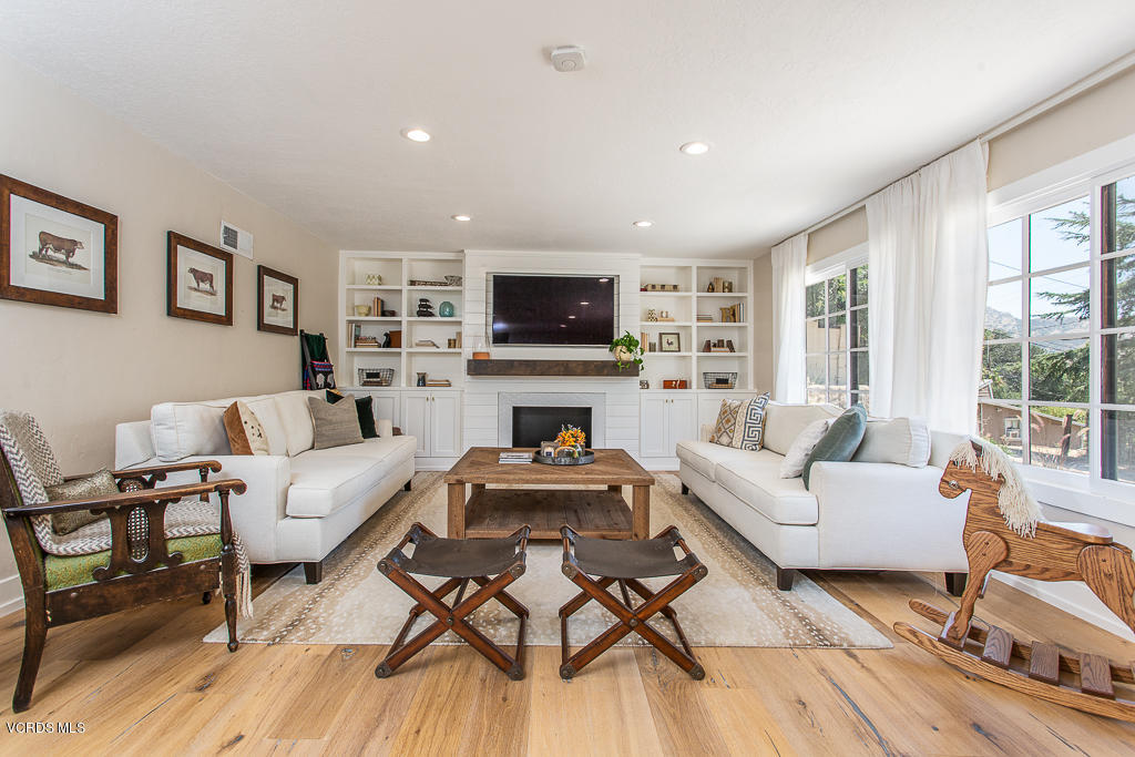 993 Katherine Road Simi Valley, CA 93063 - Photo 6 of 44 a living room with furniture fireplace and a flat screen tv