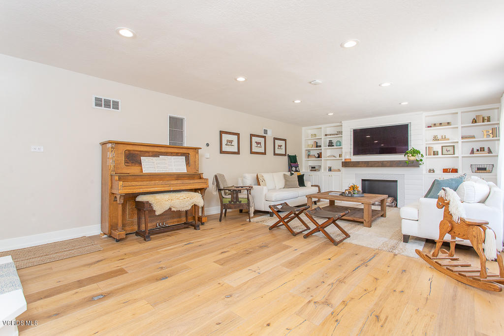 993 Katherine Road Simi Valley, CA 93063 - Photo 9 of 44 a living room with furniture and a flat screen tv