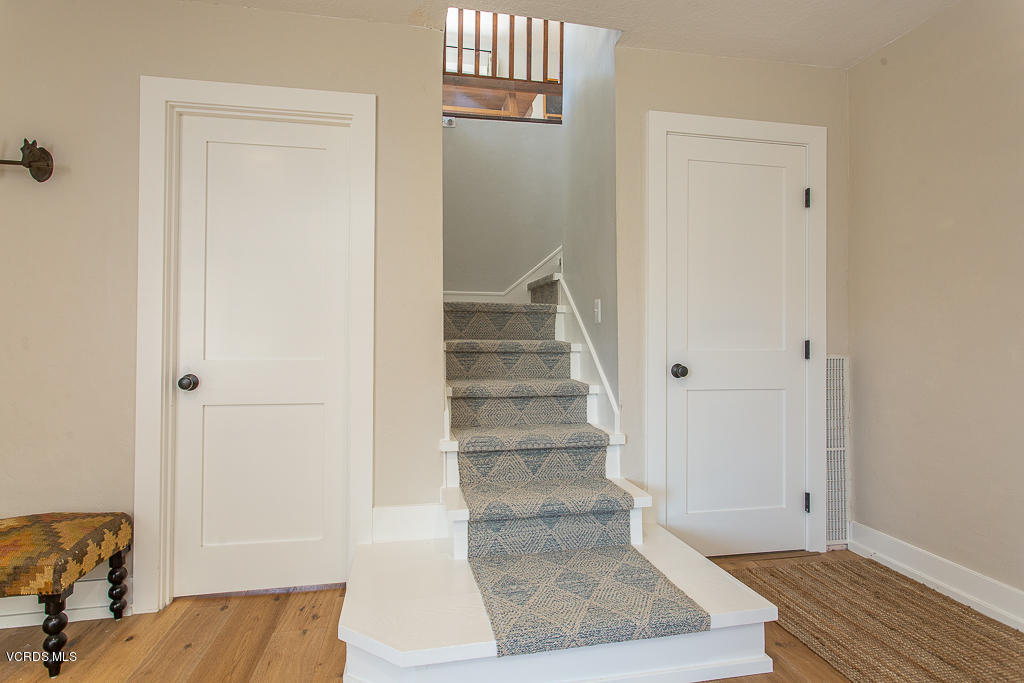 993 Katherine Road Simi Valley, CA 93063 - Photo 10 of 44 a view of a hallway with wooden floor and entryway