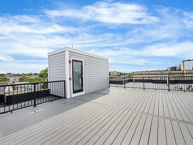 a view of a balcony with wooden floor