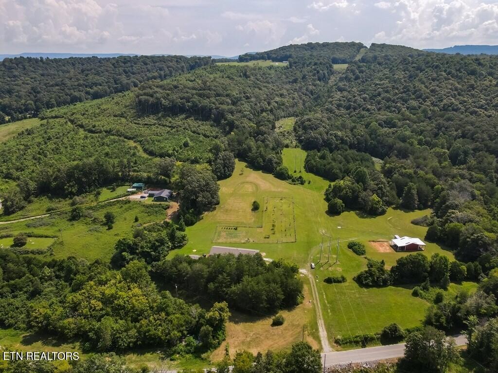 1518 Cummingsville And Sparkman Road Doyle, TN 38559 - Photo 2 of 58 an aerial view of a houses with a yard
