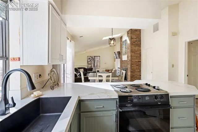 a kitchen with a stove and a sink
