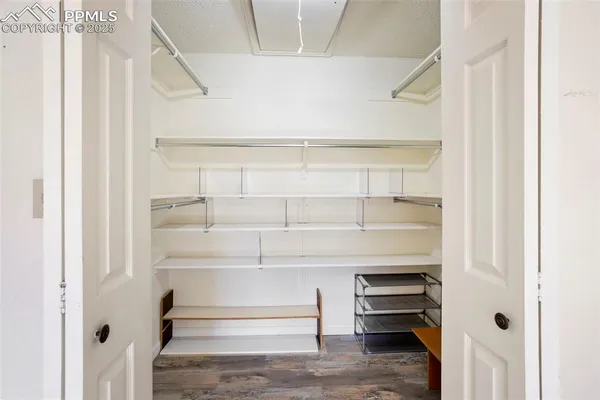 a view of an empty walk in closet