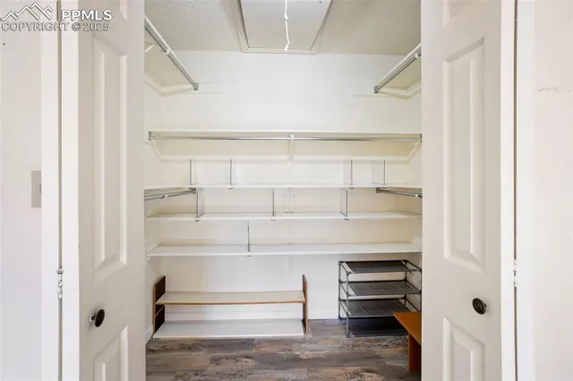 a view of an empty walk in closet