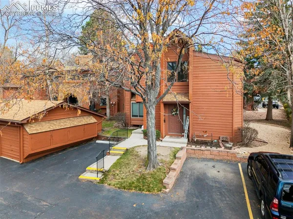a backyard of a house with yard and outdoor seating