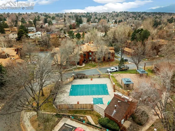 an aerial view of residential houses with outdoor space