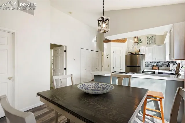 a view of a kitchen area kitchen island dining table and chairs