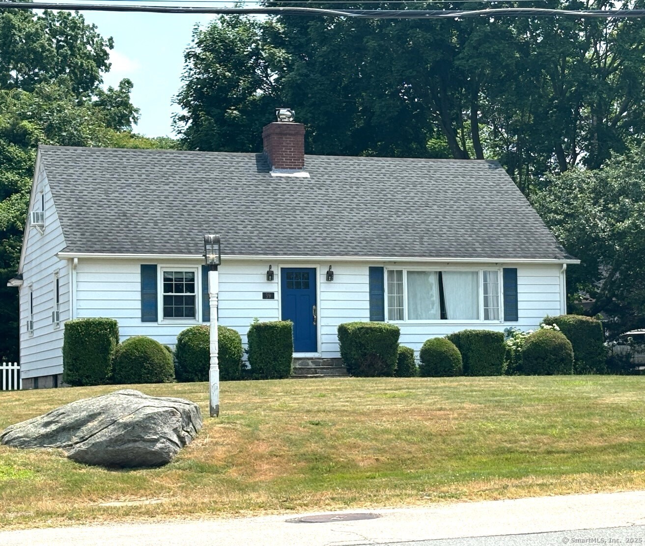 39 Masons Island Road Stonington, CT 06355 - Photo 1 of 16 a front view of a house with a yard