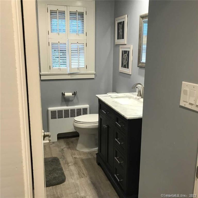 39 Masons Island Road Stonington, CT 06355 - Photo 14 of 16 a bathroom with a sink and a mirror